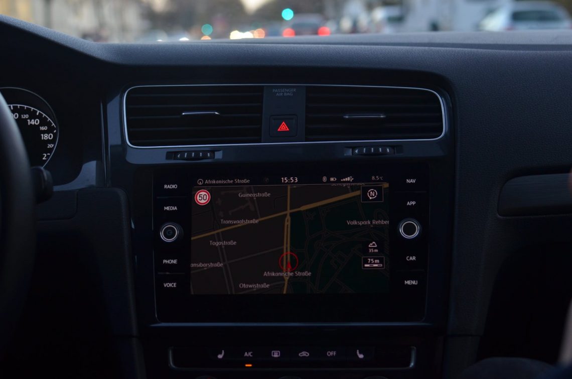 dashboard with gps navigator inside car on road